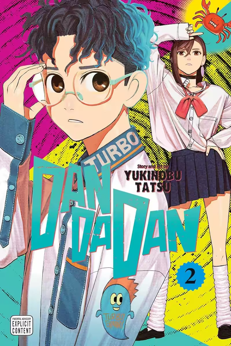 Manga forside til ‘Dandadan’ bind 2, der viser en ung mand med blå-sorte krøller og store briller forrest, mens en anden ung pige i skoleuniform står bagved i en dramatisk positur mod en neonfarvet baggrund.